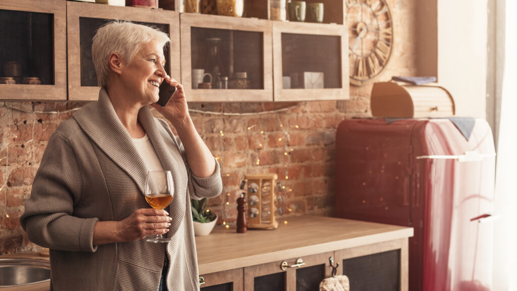 wines for mothers day mom on the phone while drinking wine in the kitchen 
