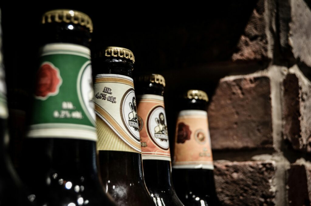 exotic beer bottles against brick wall